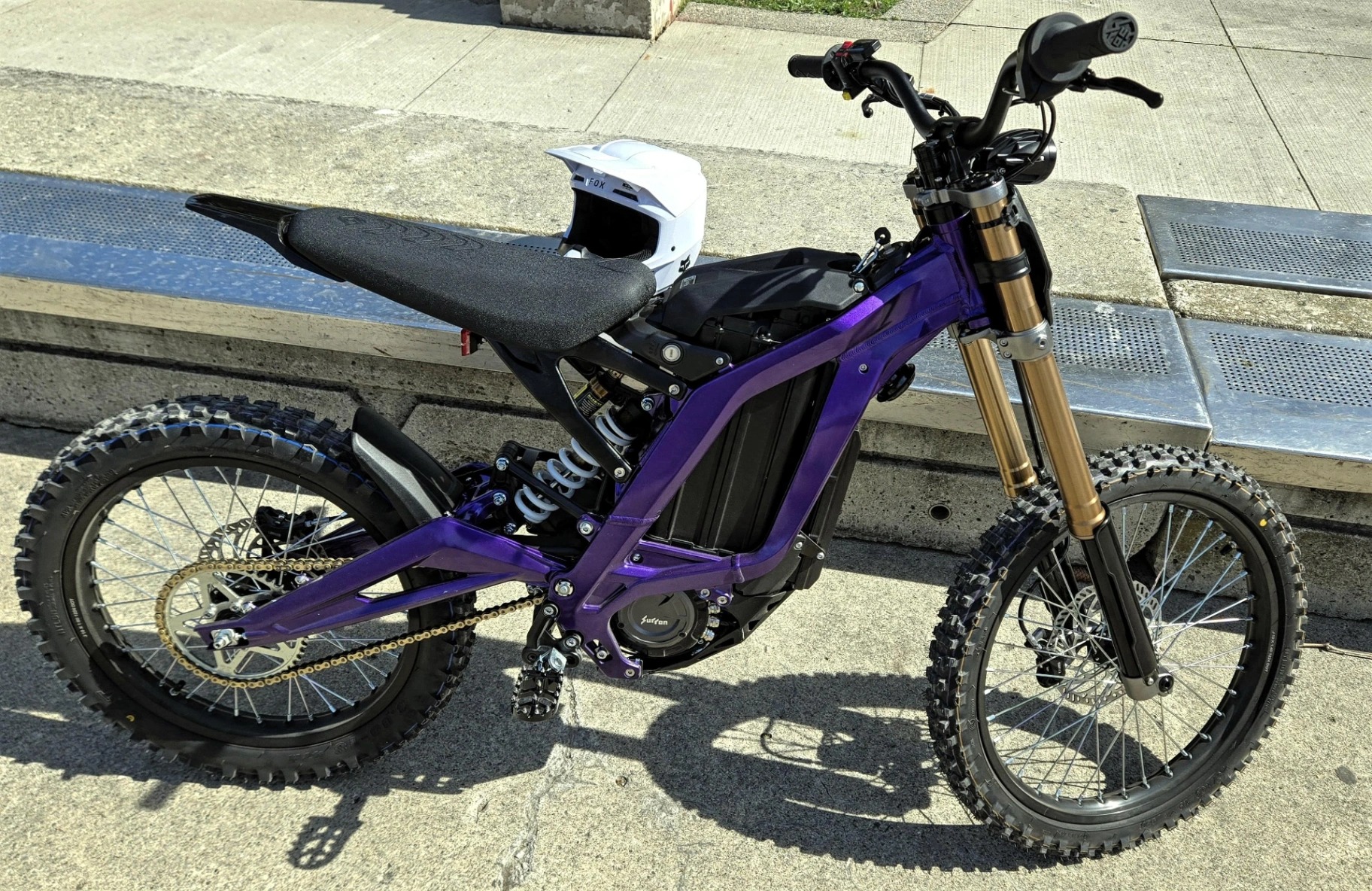 Electric dirt bike with purple accents